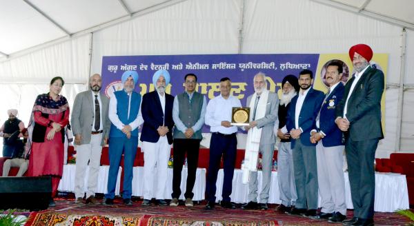 Dr. Sukhpal Singh receiving honor from Dr. Inderjeet Singh